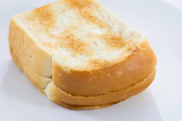 Pão torrado sobre fundo branco — Fotografia de Stock