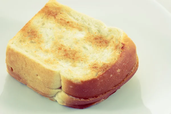 Pan tostado en el plato estilo vintage —  Fotos de Stock