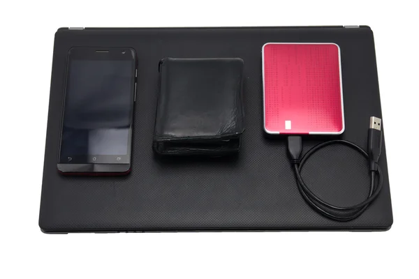 Bild med bärbar dator, mobiltelefon, plånbok extern hårddisk — Stockfoto