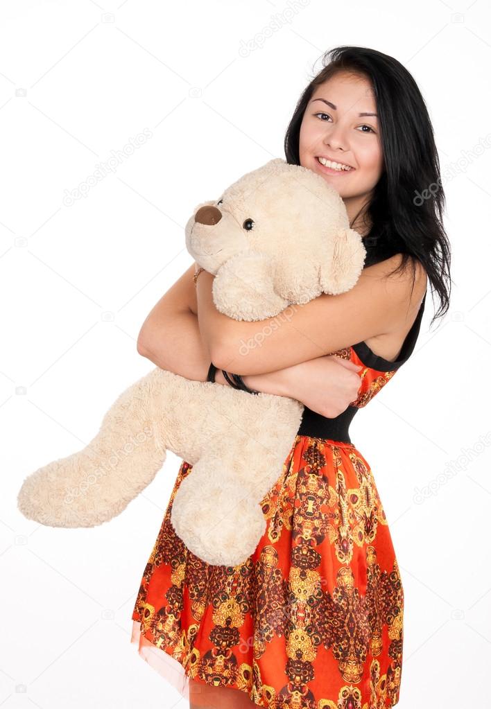 girl hugging stuffed animal