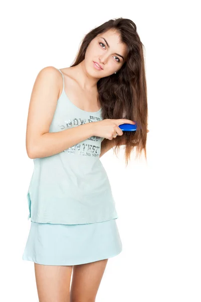 Beautiful young brunette with comb — Stock Photo, Image