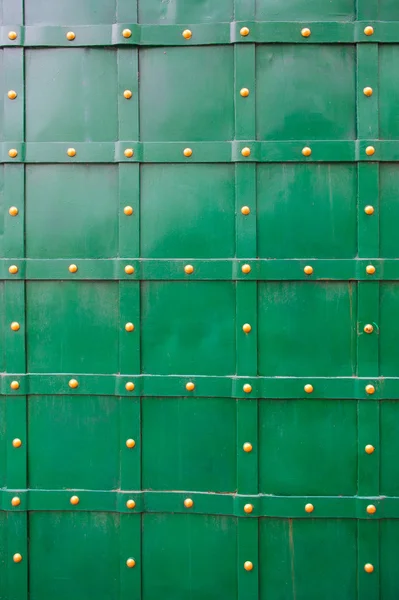 Texture of green old metal door with rivets for background — Stock Photo, Image