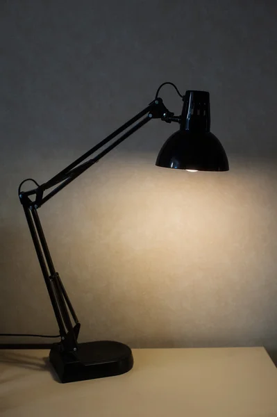 Vintage black reading table lamp turn on in room — Stock Photo, Image