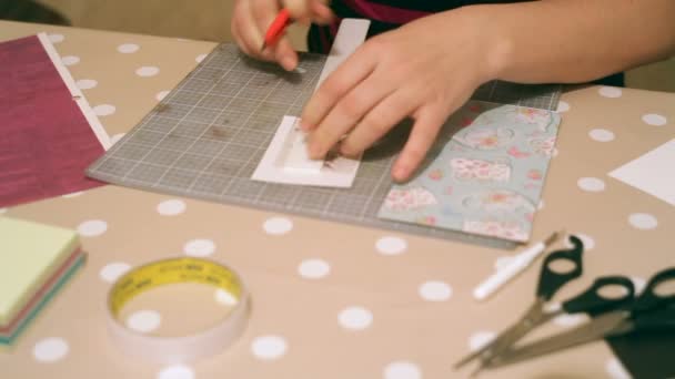 Hands of a woman crafting and scrap-booking christmas cards — Stock Video