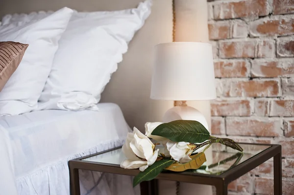 Comfortable and serene bedside with lamp by the bed — Stock Photo, Image