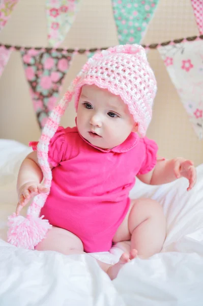 Adorable little baby girl sitting on the floor studio shot lovely portrait — Stock Photo, Image