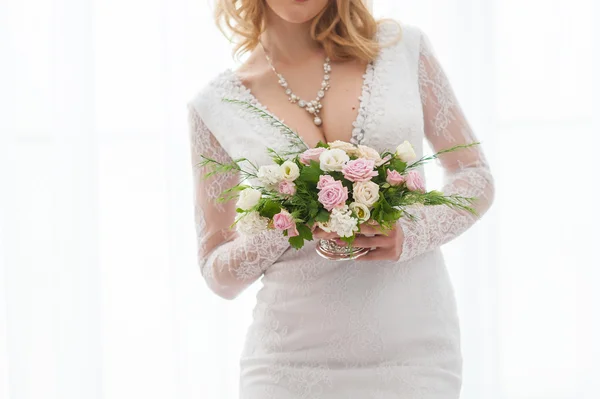 Bride with a wedding bouquet in hands — Stock Photo, Image