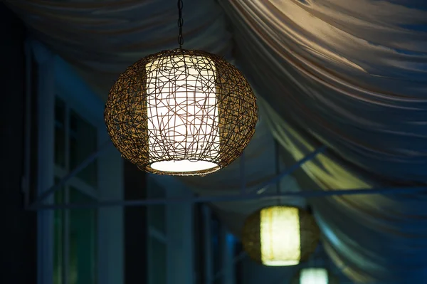 Included chandeliers in the evening cafe outdoor — Stock Photo, Image