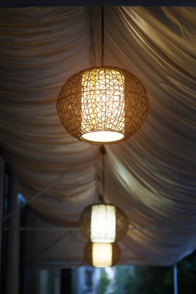 Included chandeliers in the evening cafe outdoor — Stock Photo, Image