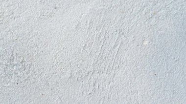 Doğal çimento ya da eski taş dokunun antika ya da pis beyaz arka planı. Bu bir konsept duvar afişi, grunge, materyal, eski bir yapı ve metin için yeri var. Video görüntüleri