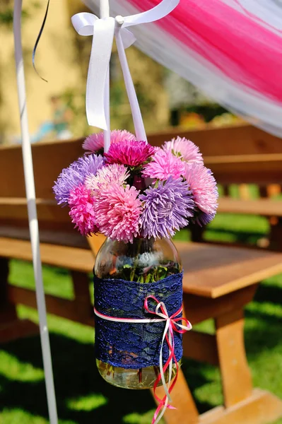 Decor jar with flowers outdoors — Stock Photo, Image
