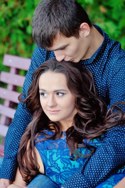 Guy kisses and hugs his girlfriend — Stock Photo, Image