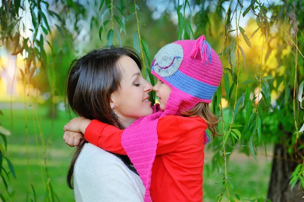 Bright picture of hugging mother and daughter — Stock Photo, Image