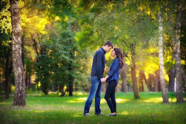 Man and woman couple flirting in a park — Stock Photo, Image