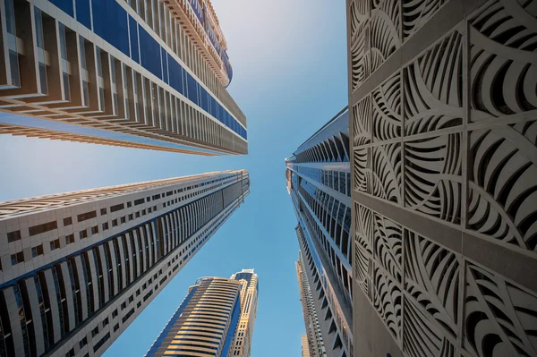 Looking up at a group of modern office buildings — Stock Photo, Image