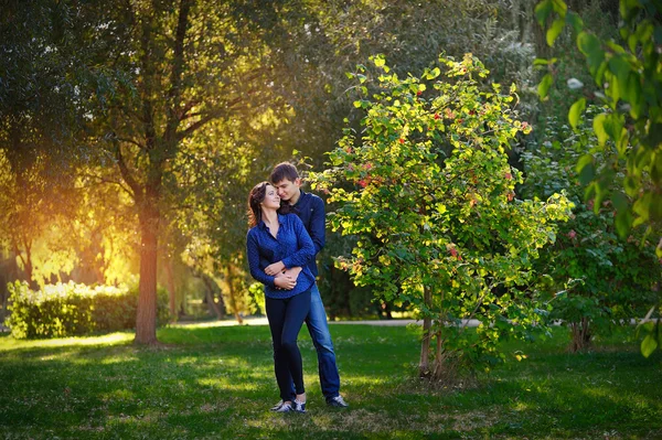 Romantic teenage couple embracing outdoors — Stock Photo, Image