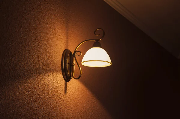 Lighted classic lamp on the wall — Stock Photo, Image