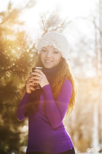 Beautiful happy girl in the red jacket in the winter. — Stock Photo, Image