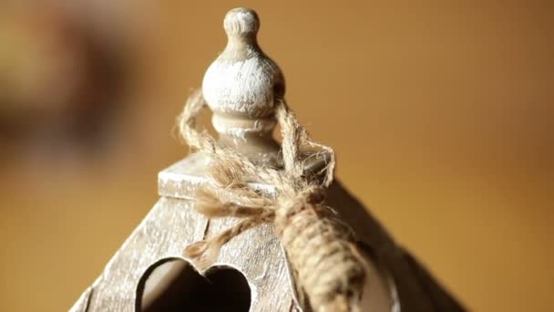 Elements wooden candlestick close-up with a window in the form of heart — Stock Video