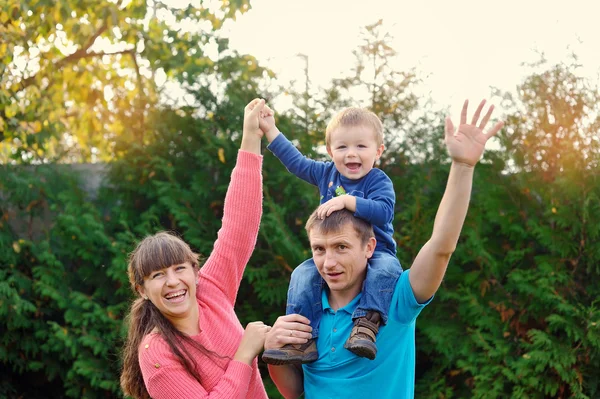 Happy parents and son enjoyed a walk in the park — Stock Photo, Image