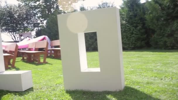 Large letters LOVE on the grass on wedding — Stock Video