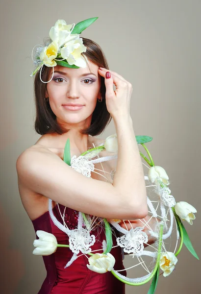 Woman with tulips bouquet of flowers smiling — Stock Photo, Image