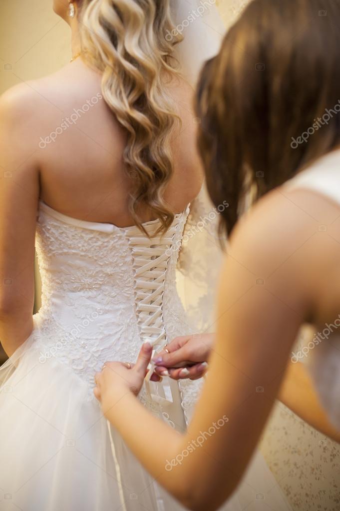 Girlfriend Tying Corset Bride On Wedding Stock Photo By C Timonko 57594429
