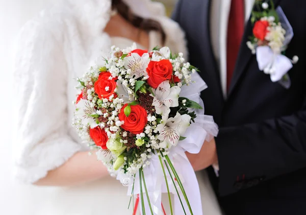 Bride and groom holding bridal bouquet close up Royalty Free Stock Photos