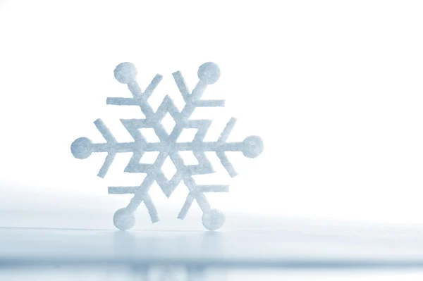 Snowflake made of felt isolated on a white background — Stock Photo, Image