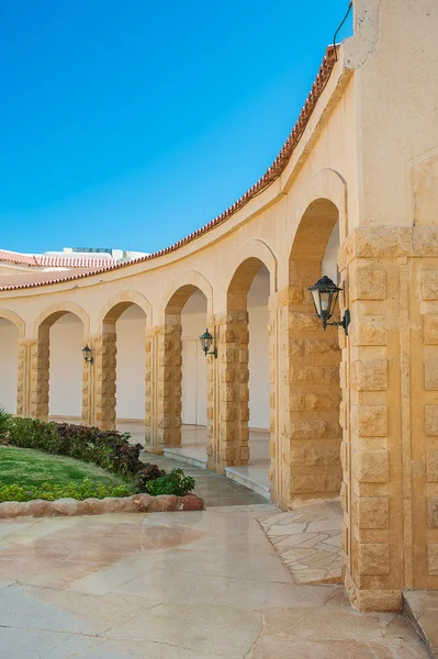 Beige architectural arches in perspective — Stock Photo, Image