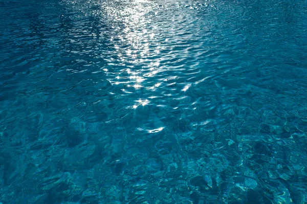 Textura del agua con reflejos del sol — Foto de Stock