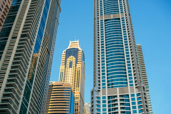 Detail of skyscrapers facade with windows in blue and yellow col — Stock Photo, Image