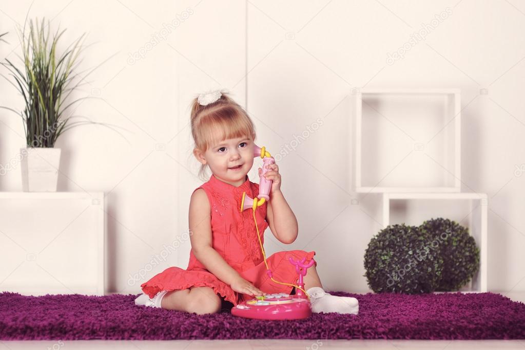 little girl talking on the phone