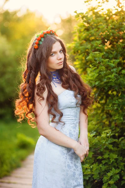 Beautiful girl with a wreath on the head of cherries — Stock Photo, Image