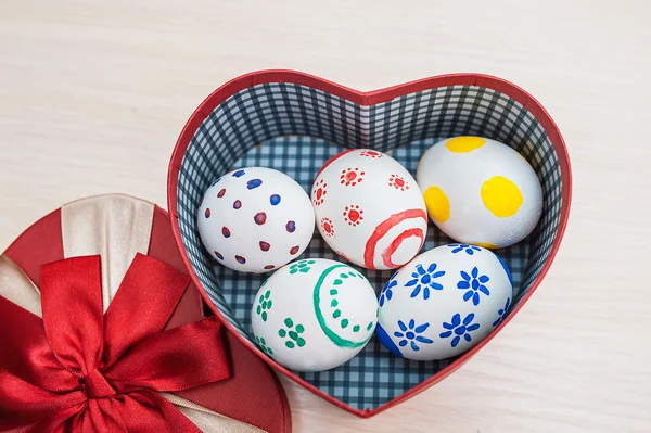 Easter eggs in a box in the shape of heart — Stock Photo, Image