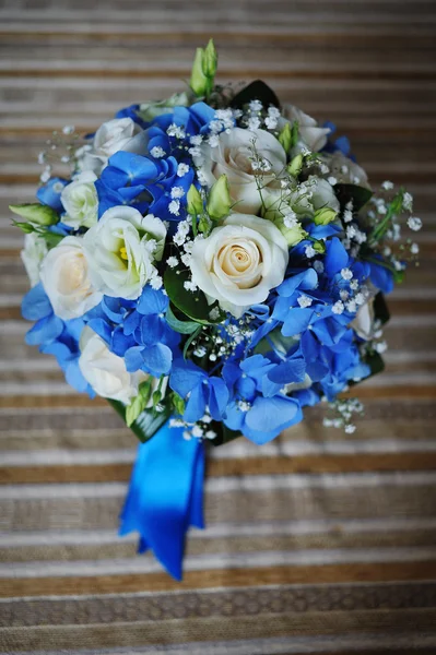 Bridal bouquet of white roses and blue ribbons Stock Photo