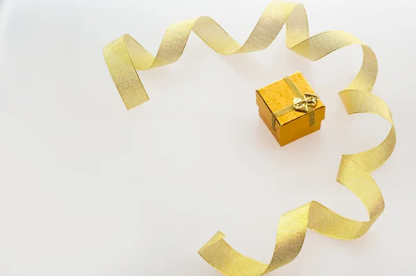 Gift with gold ribbon, place for your text — Stock Photo, Image