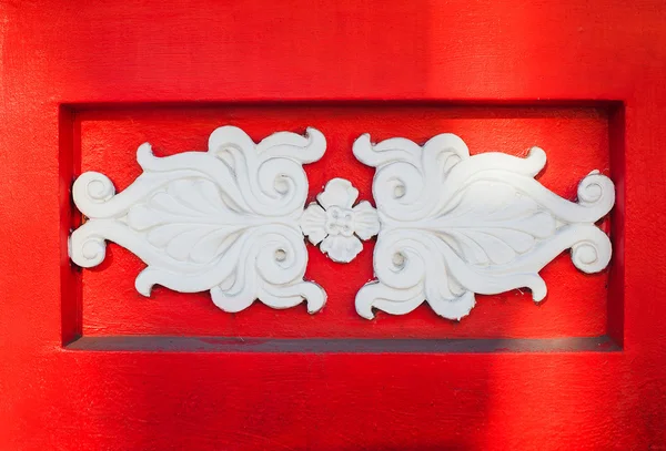 Beautiful white architectural relief pattern on red background — Stock Photo, Image