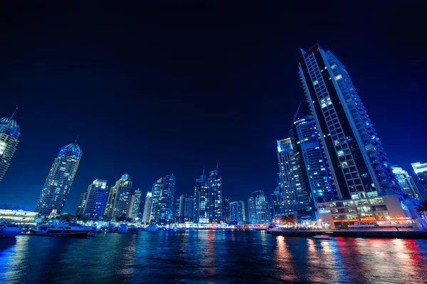 Night view of the skyscrapers in Dubai. — Stock Photo, Image