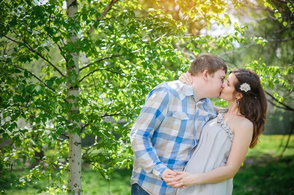 Loving couple walking in the spring park — Stock Photo, Image