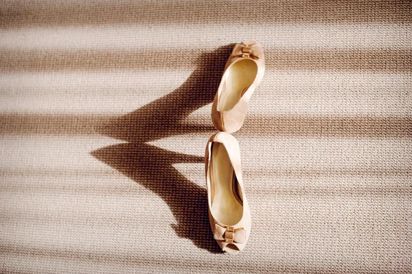 Beautiful bride's shoes on the floor — Stok fotoğraf