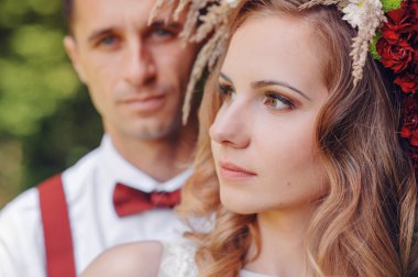 happy bride and groom walking in spring day