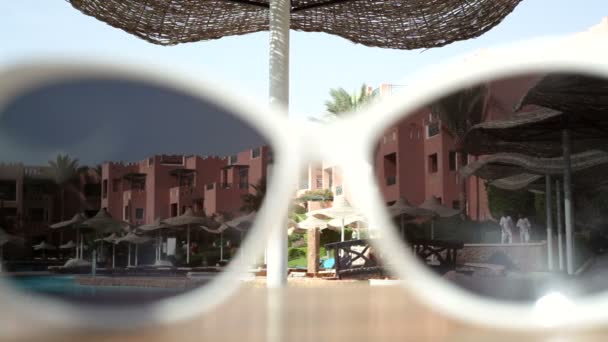 View of the building through sunglasses — Stock Video