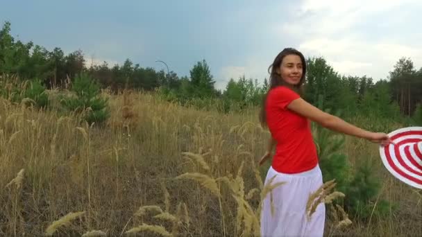 Beautiful woman in a red shirt walking — Stock Video