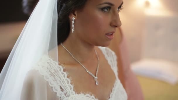 Bride trying on wedding dress before the mirror — Stock Video