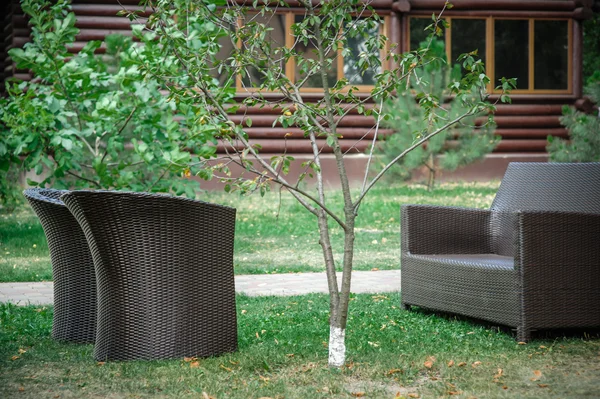 Sofa and two chairs near the house — Stok fotoğraf