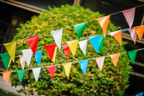 Multicoloured flags in the street — Stock Photo, Image