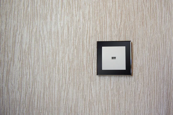 Glass photo frame hanging on the wall in the room — Stock Photo, Image