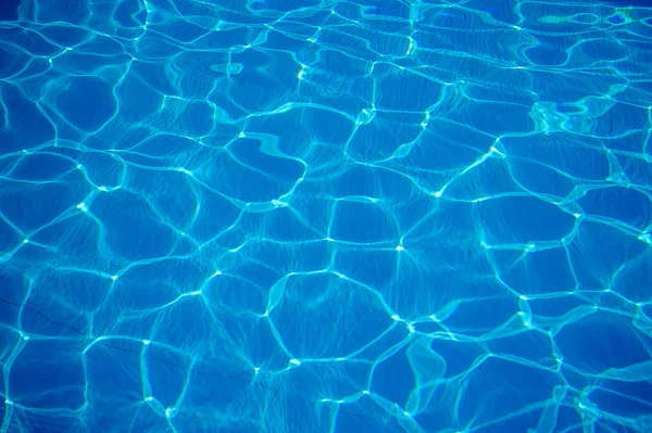 Kék textúra a víz a medencében — Stock Fotó