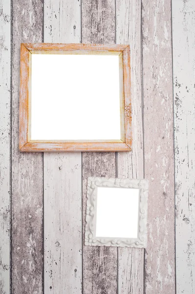 Dois moldura de foto vintage em uma parede de madeira — Fotografia de Stock